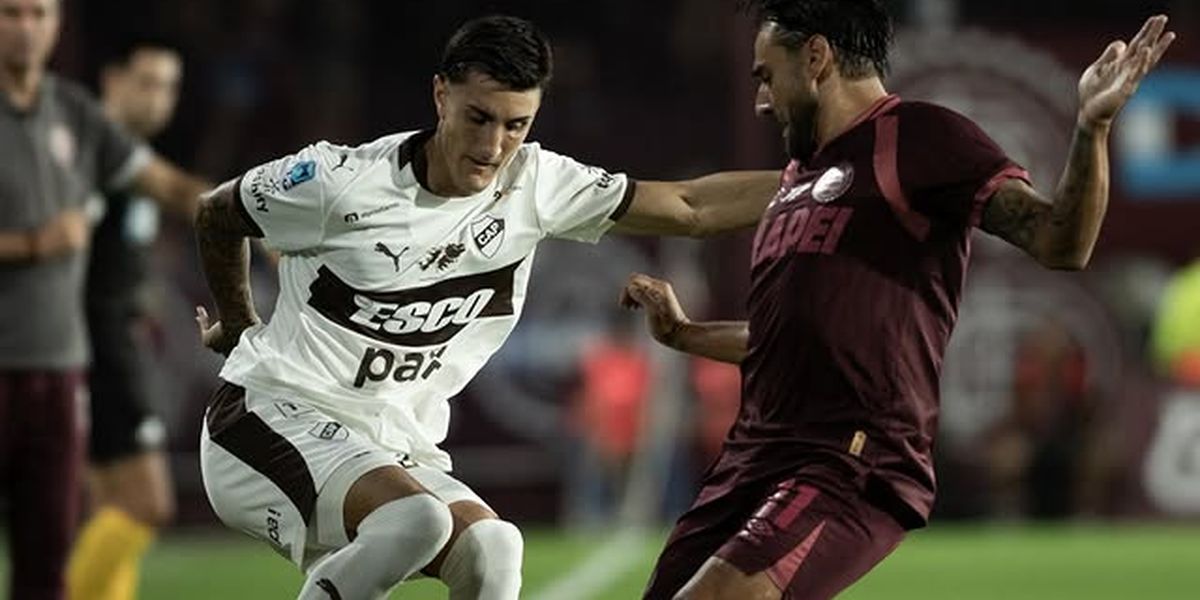 Eduardo Salvio con Juan Saborido.