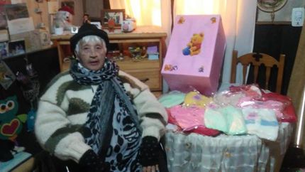 Álida junto a las donaciones que serán llevadas al Gandulfo.