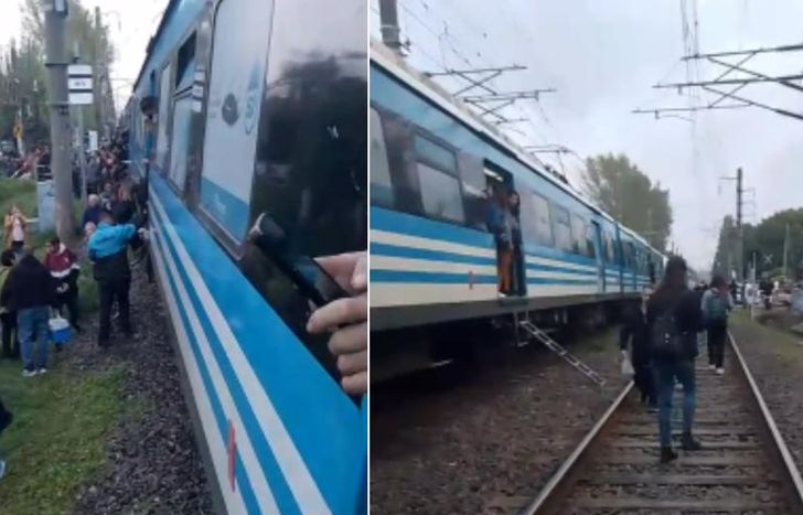 Los pasajeron bajaron de los vagones detenidos.