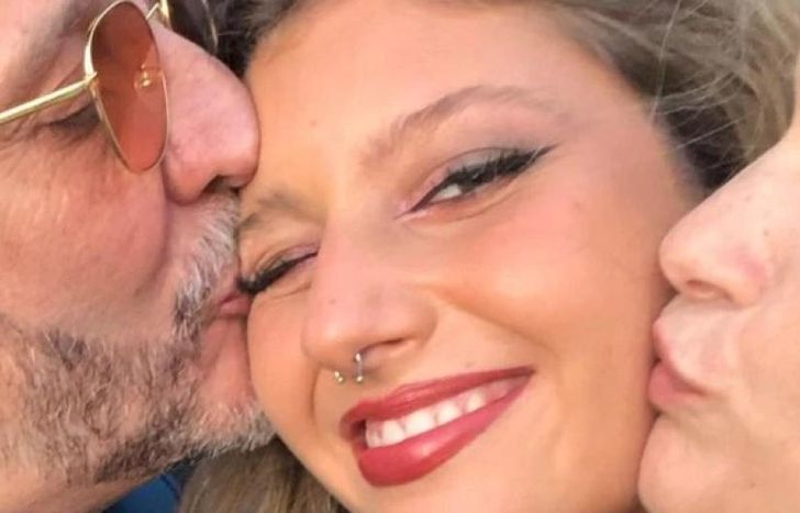 Margarita, con papá y mamá.